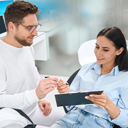 Woman in dental chair filling out forms