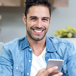 Smiling man with cell phone
