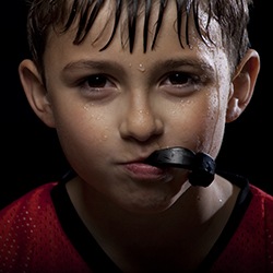 Child with sportsguard in mouth