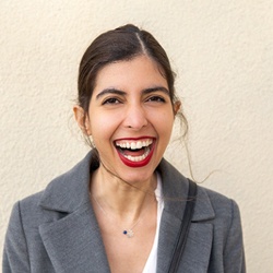 A young woman with excessive gum tissue smiling