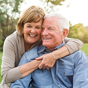 Senior couple smiling outdoors