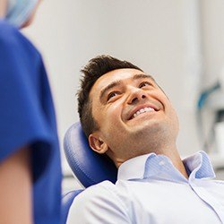 Smiling man in dental chair