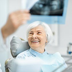 Dentist explaining dental implant treatment to patient