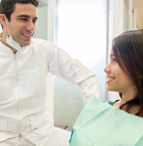 patient talking with dentist