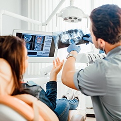 Dentist showing woman her x-rays