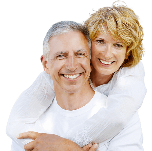 Smiling older man and woman holding each other