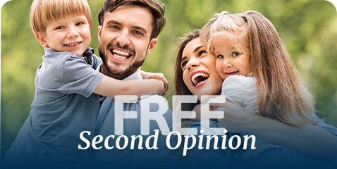 Smiling family of four outdoors