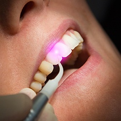 Patient receiving laser dental treatment