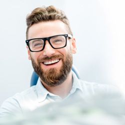 man smiling after getting veneers in Homer Glen 