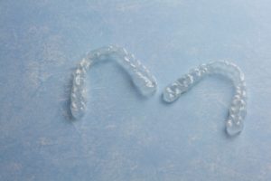 A pair of aligners sitting on a table.