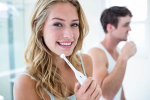 Couple brushing teeth together