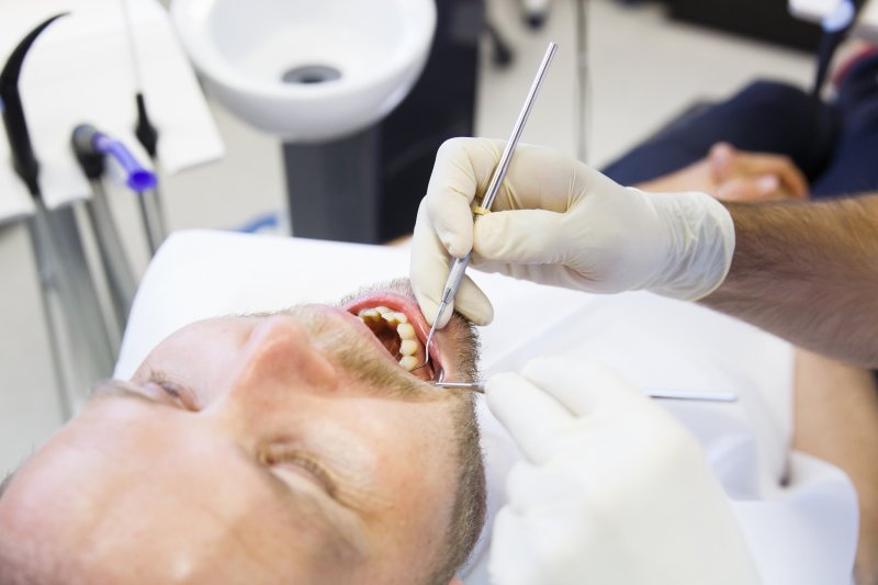 a dentist checking for gum disease