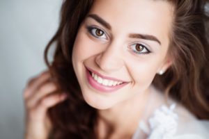 young woman smiling with white teeth