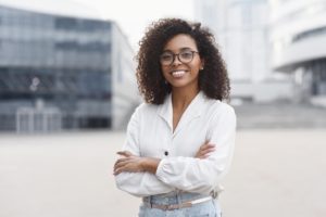 Smiling, confident career woman after cosmetic dental treatments