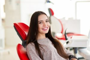 happy patient talking to a cosmetic dentist before a smile makeover