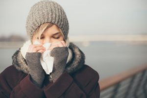 a woman with a cold