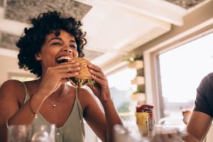 a person eating a sandwich