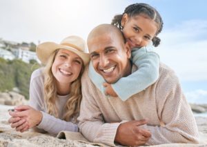 a family with beautiful smiles enjoying their summer vacation