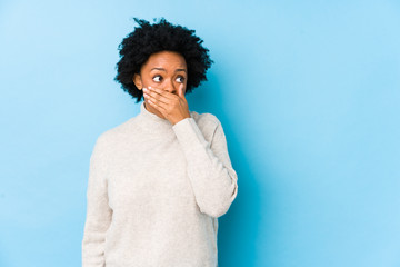 person suffering from tooth decay covering mouth